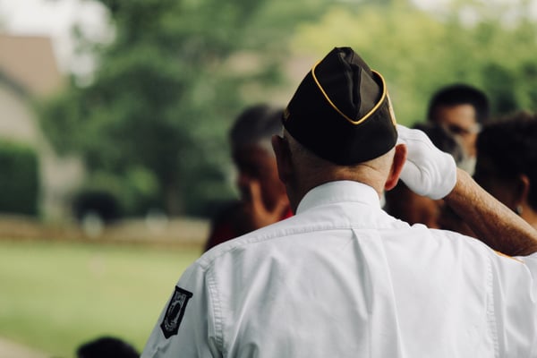 veteran saluting photo by sydney rae on unsplash